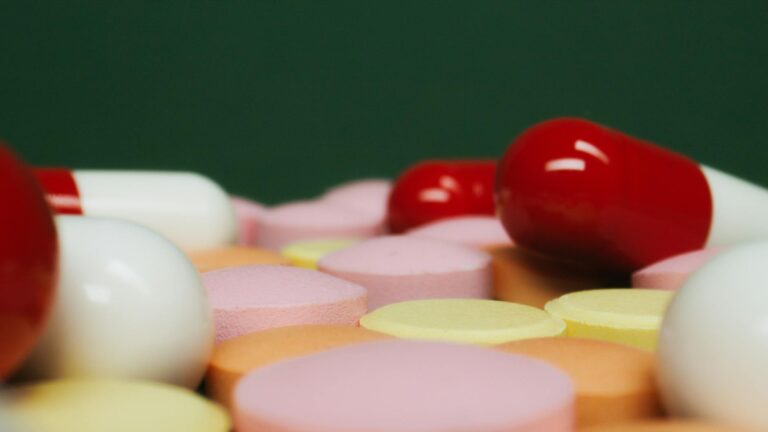 a group of capsules and tablets in close up shot