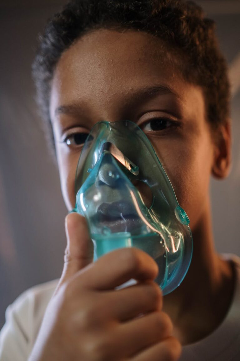 portrait of boy with inhaler