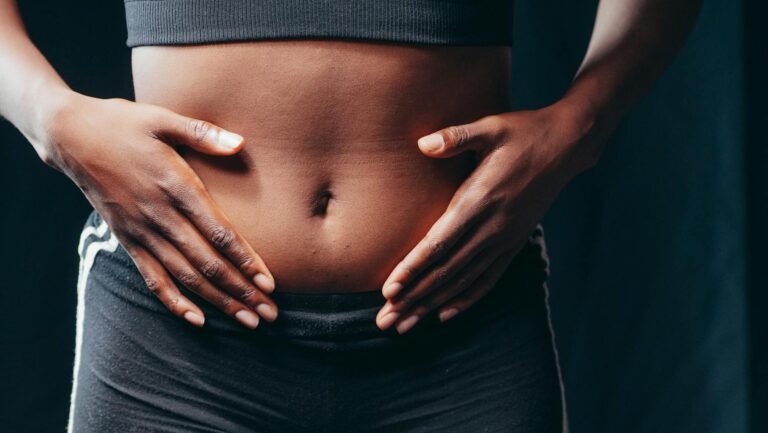 a person touching her belly